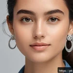 Home 18 여성용 드롭 이어링 추천 - A close-up portrait of a young woman with an oval face shape wearing minimalist drop earrings made o...